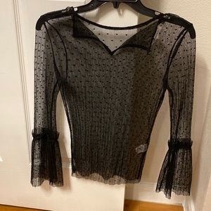 Black see through blouse with ruffle detail in the sleeves